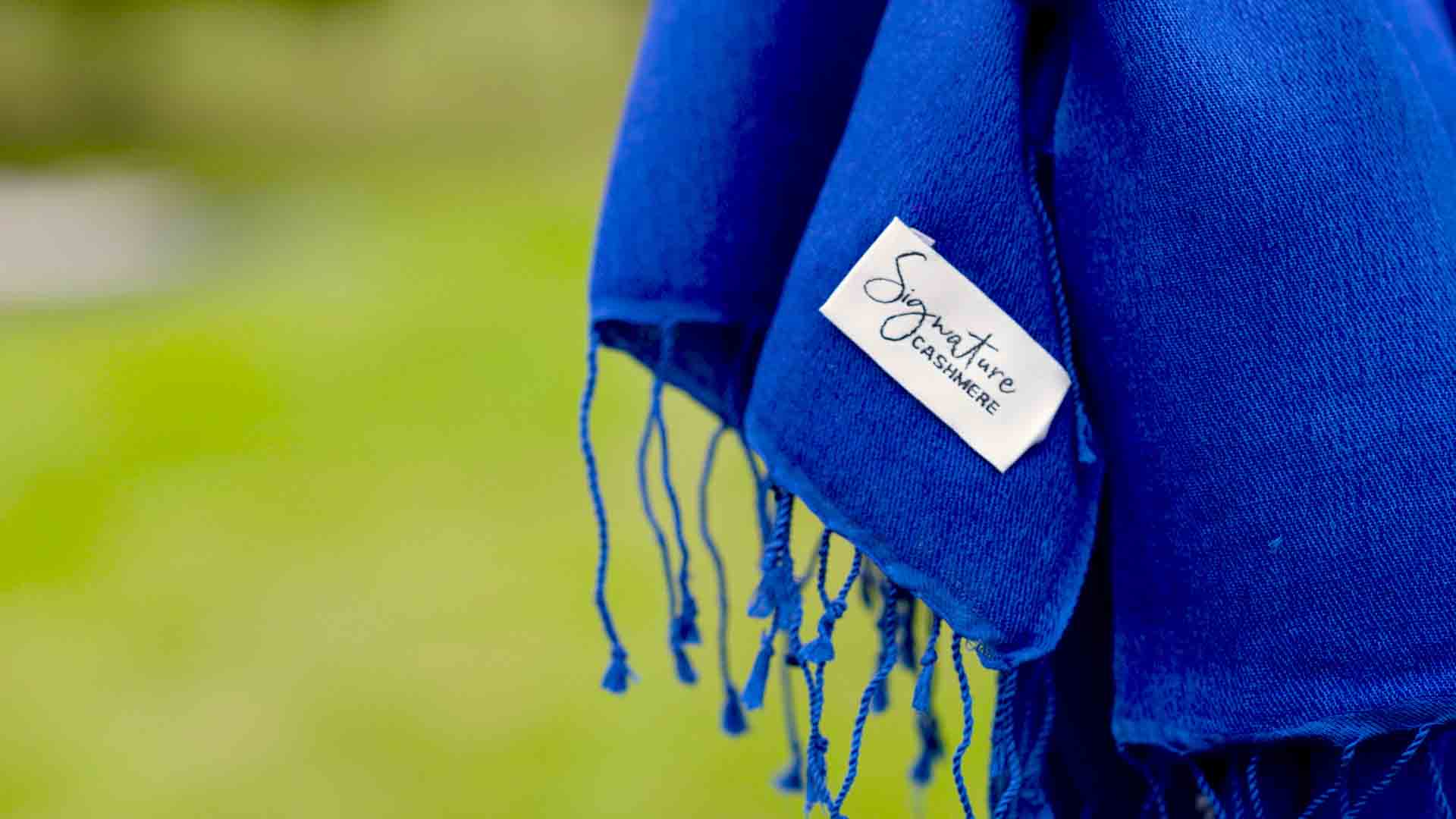 Close up of a blue Signature Cashmere scarf