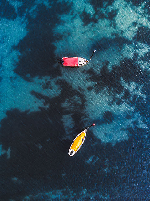 zoomed out sea with two boats zoomed out sea with two boats