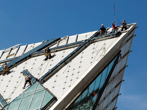 workers attached to building side workers attached to building side