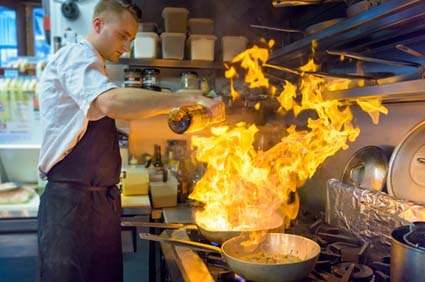Beekeeper tending to beehive