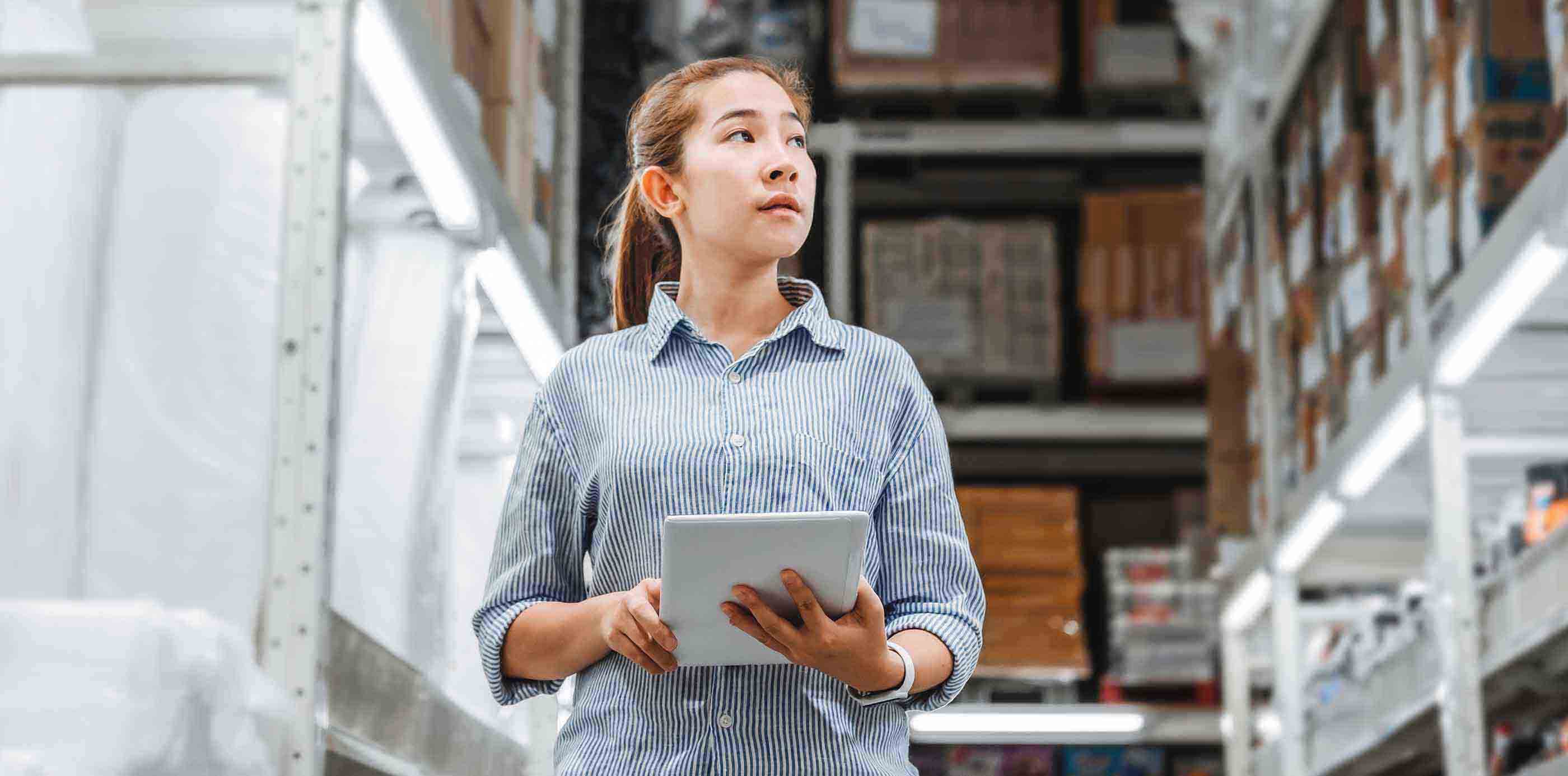 Businesswoman in warehouse with tablet