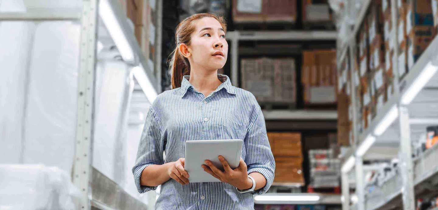 Businesswoman in warehouse with tablet Businesswoman in warehouse with tablet