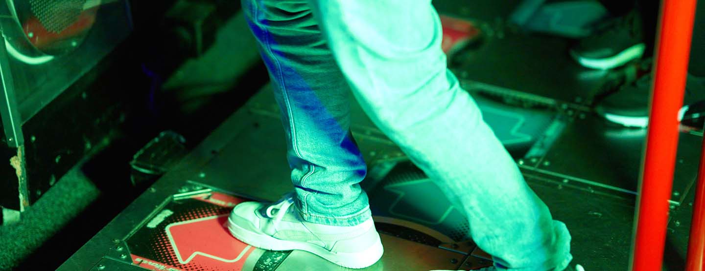 Close up of person playing arcade game Close up of person playing arcade game