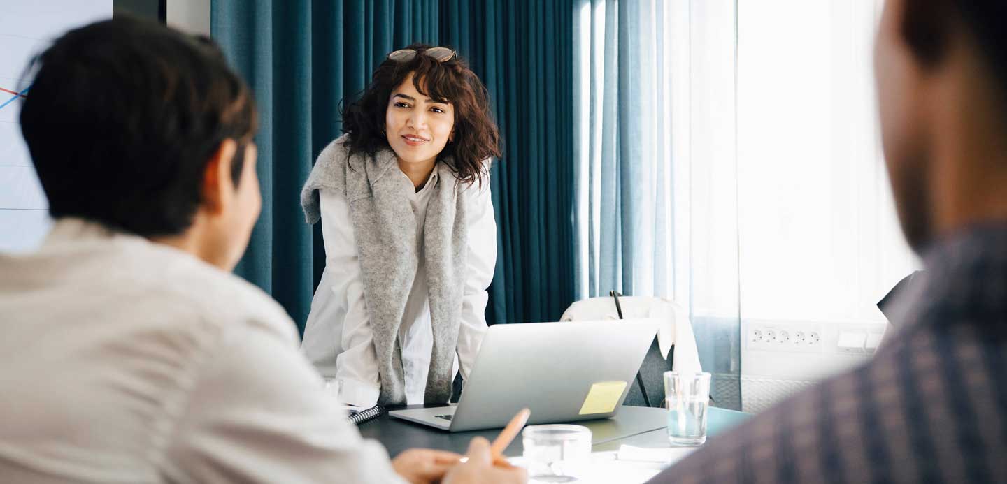 Woman business owner leading a meeting		