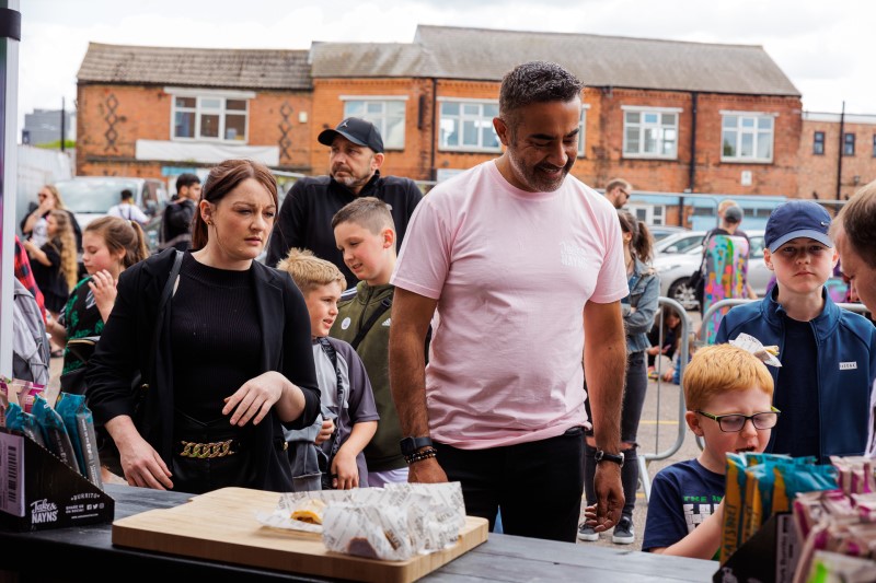 Jake Karia and customers at a food stall Jake Karia and customers at a food stall