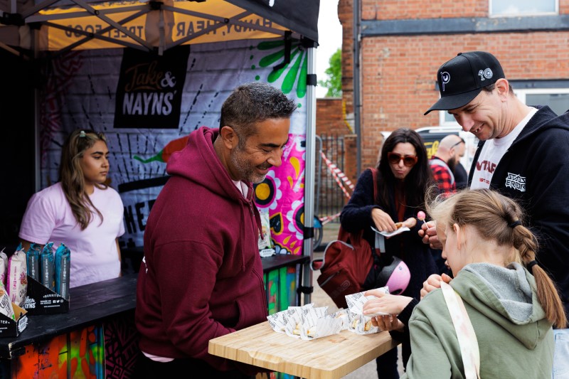 Jake Karia and customers at a food stall Jake Karia and customers at a food stall
